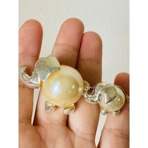 Vintage silver tone double elephant faux pearl brooch